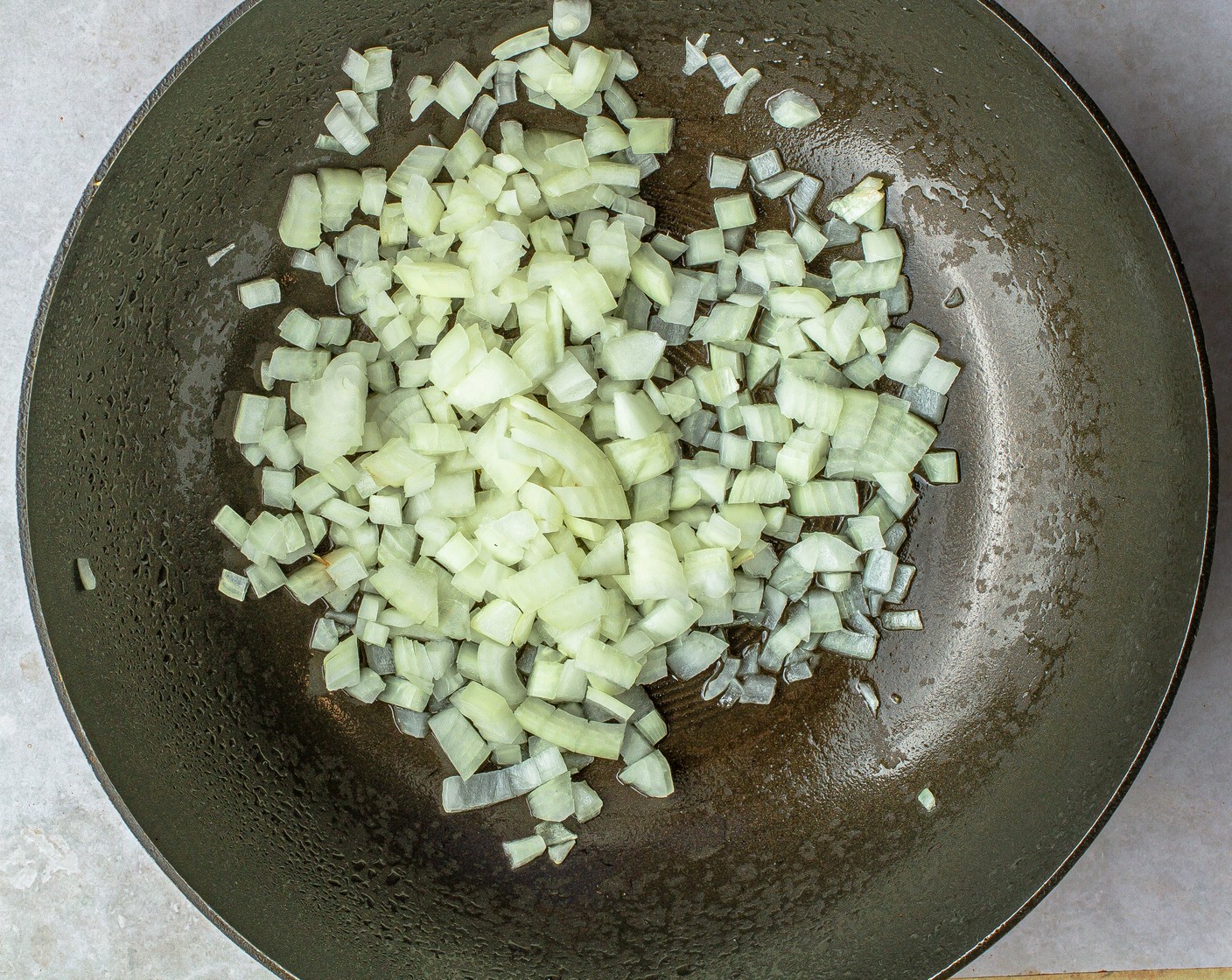 step 1 Over high heat, add Nonstick Cooking Spray (as needed) to a wok or large nonstick skillet. Add Onion (1) and cook until fragrant, about 1 minute.