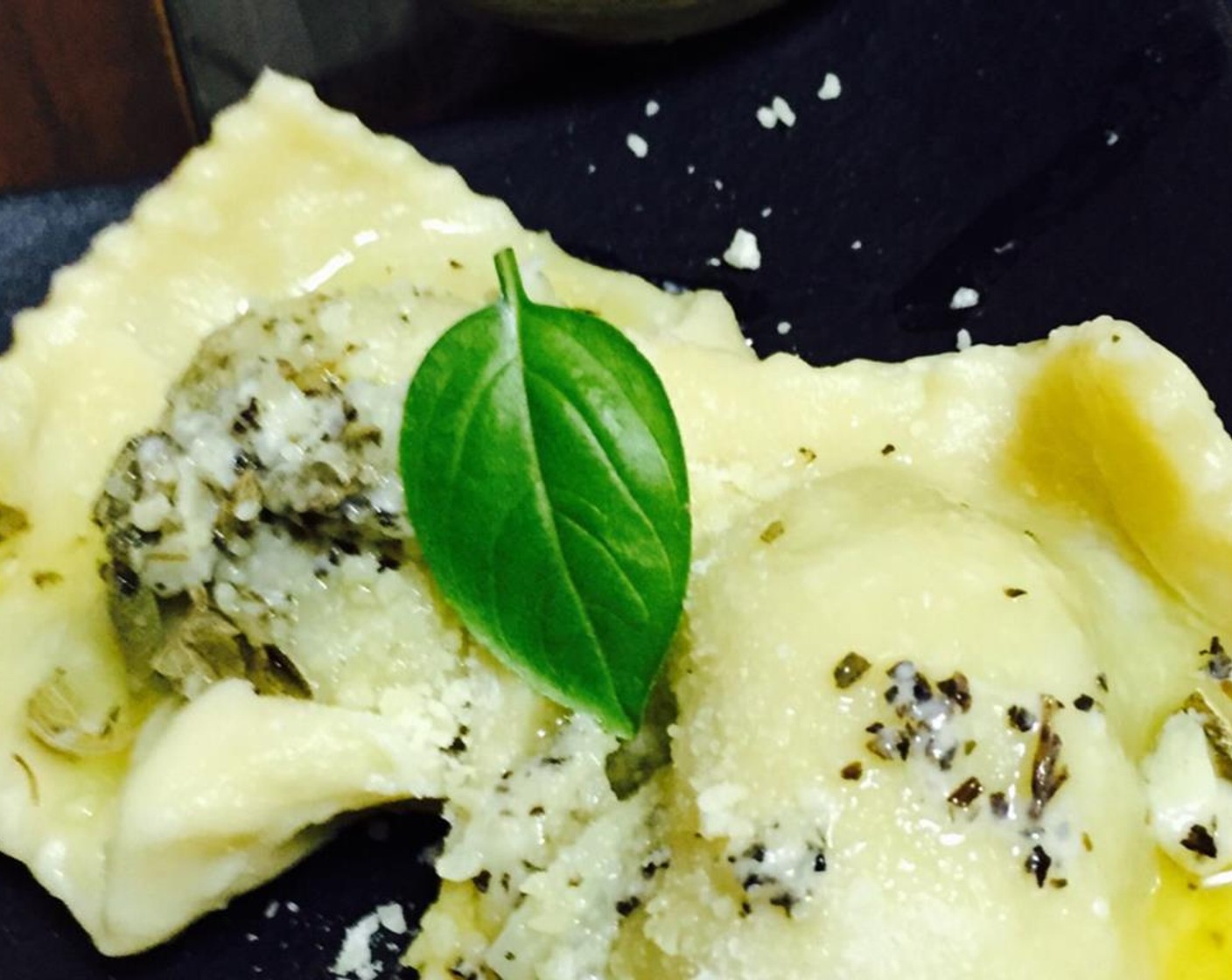 step 8 Toss strained ravioli in butter and sage sauce, or plate first and cover. Top with grated Parmesan Cheese (2 pinches). Enjoy!