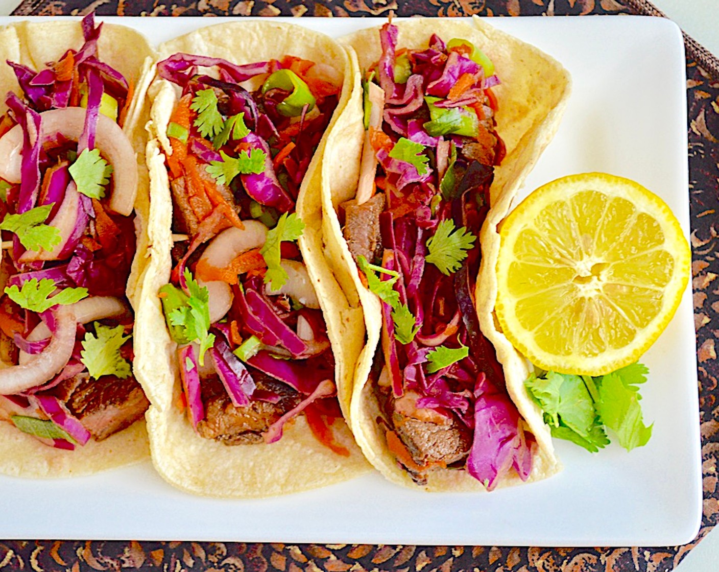 step 7 Meanwhile, warm the 6-Inch Corn Tortillas (12). Then spoon a generous amount of meat and slaw on each tortilla and serve immediately. Enjoy!