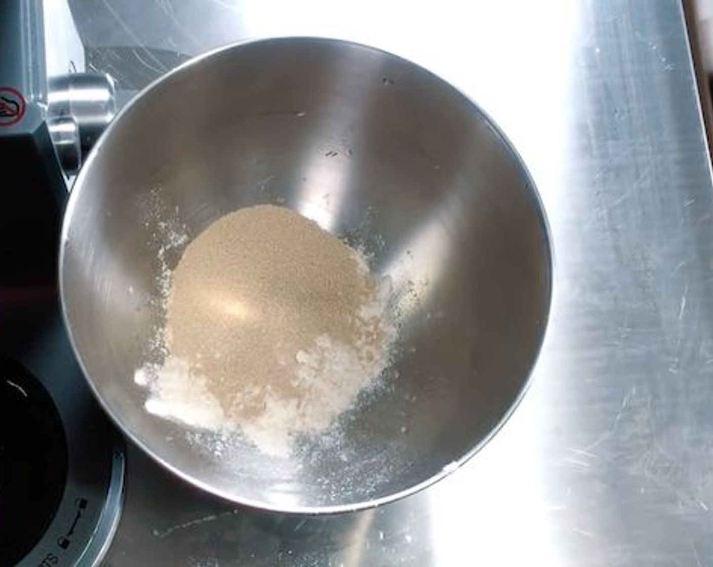 step 1 In your mixing bowl add 4 Tbsp all-purpose flour, Instant Dry Yeast (1 Tbsp), and Water (2 Tbsp). Mix together, cover, and let it rest for 15 minutes.