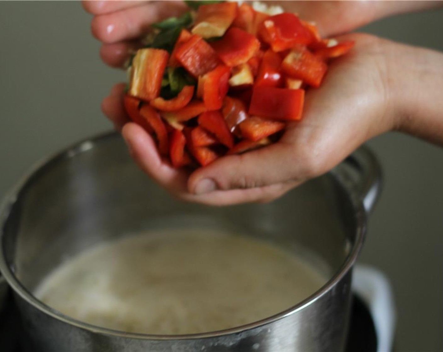 step 5 Add the bell pepper, onion and jalapeno to the pot, and simmer for 10 to 15 minutes.