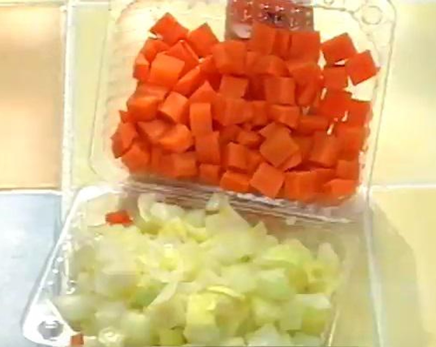 step 1 Peel your Carrot (1), and Onion (1), and slice each into pieces. Put them aside inside a container while you prepare the rest of the recipe