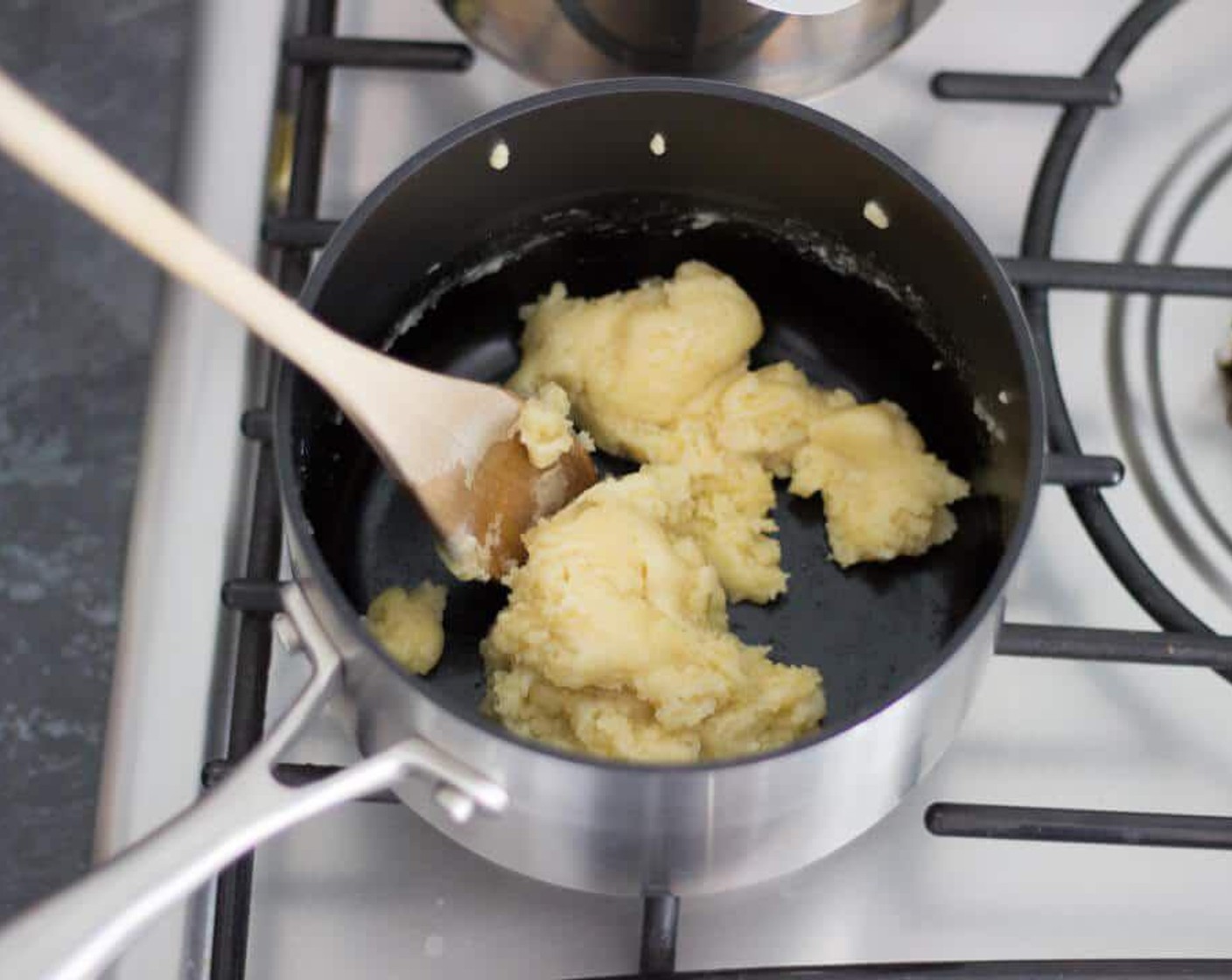 step 5 Next, gradually add in the Whole Milk (3 cups) a little at a time – beating well after each addition. To start with, it will look lumpy and a bit horrendous. But keep going, it will get more sauce like the more milk you add. Just make sure to beat it well to work out all those lumps.