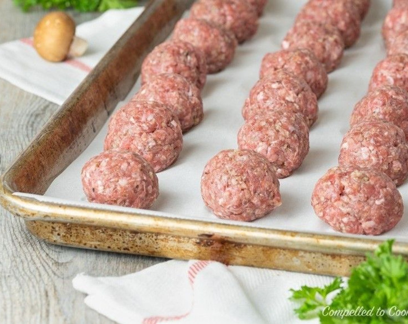 step 3 Roll into 1-ounce meatballs (about 2 tbsp each) and arrange on a large baking tray lined with parchment. Will yield about 38 meatballs. Bake for 15 minutes and remove from oven.