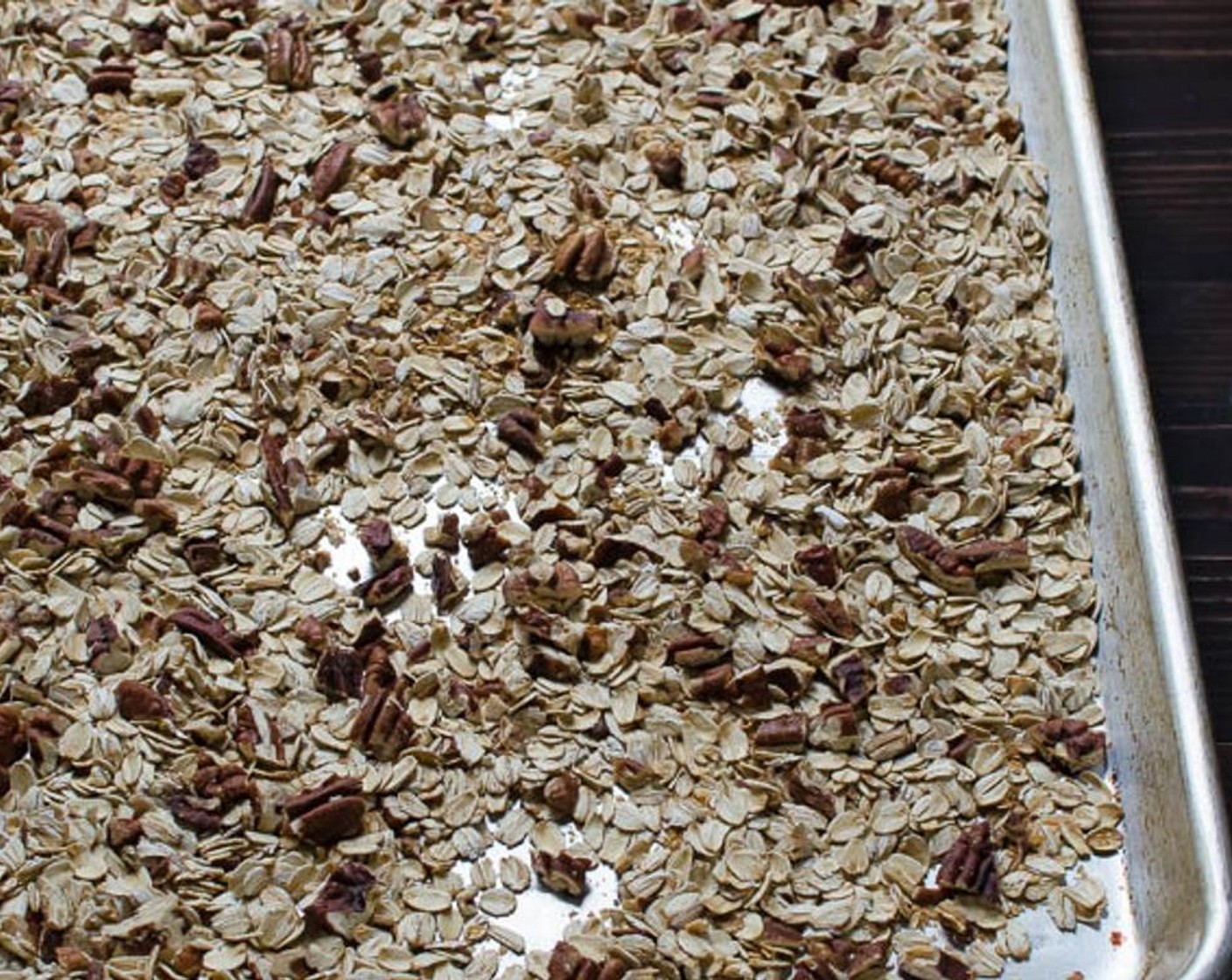 step 2 Spread the Old Fashioned Rolled Oats (2 cups) and Pecans (1 1/2 cups) in an even layer on a baking sheet and toast in the oven for 10-12 minutes. Set aside.