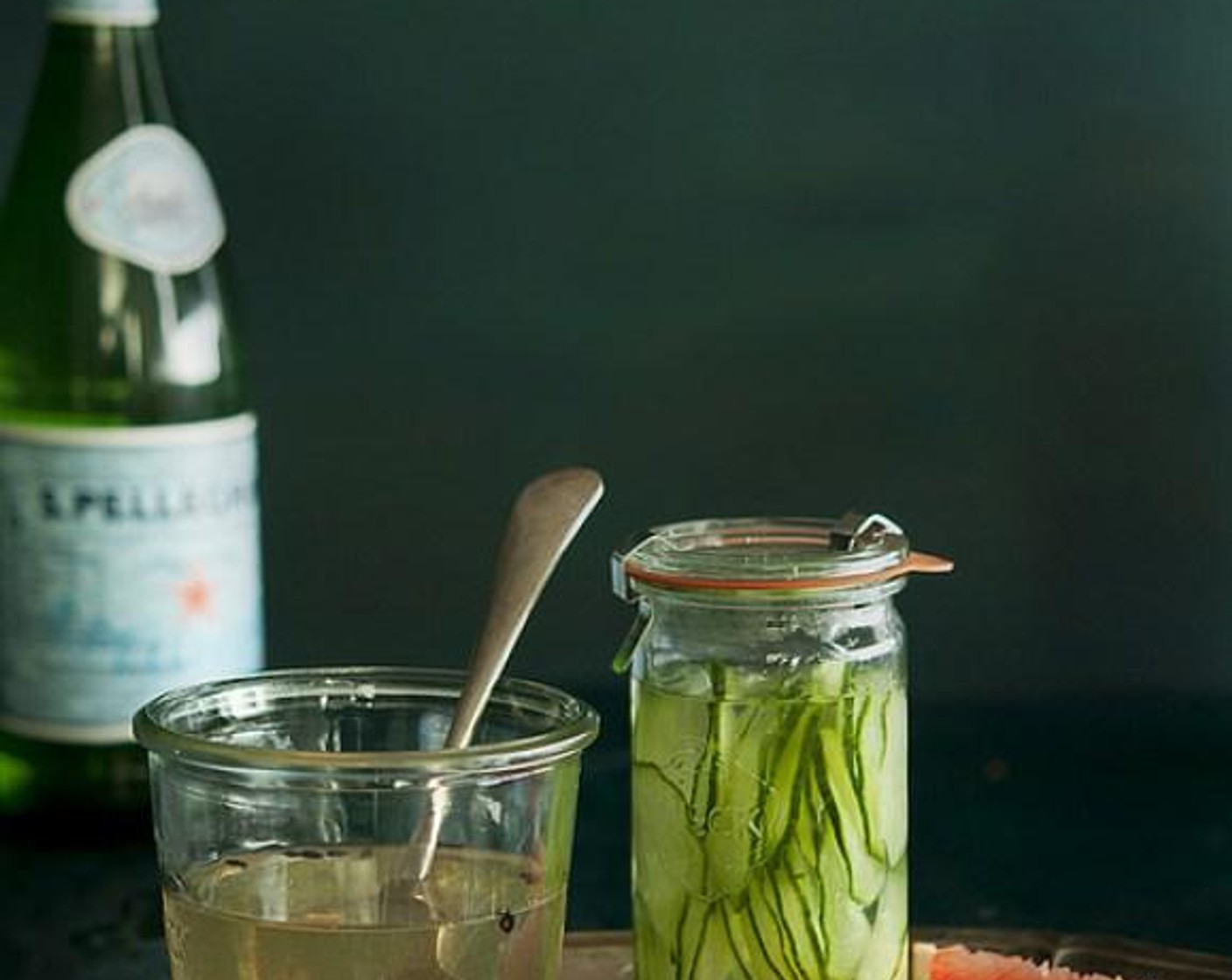 step 1 Place English Cucumber (1/2) in a small pitcher or jam jar. Mash with a muddling tool or a wooden spoon until cucumbers release juices. Add Gin (2 cups), cover, and refrigerate at least 12 hours and up to 3 days.