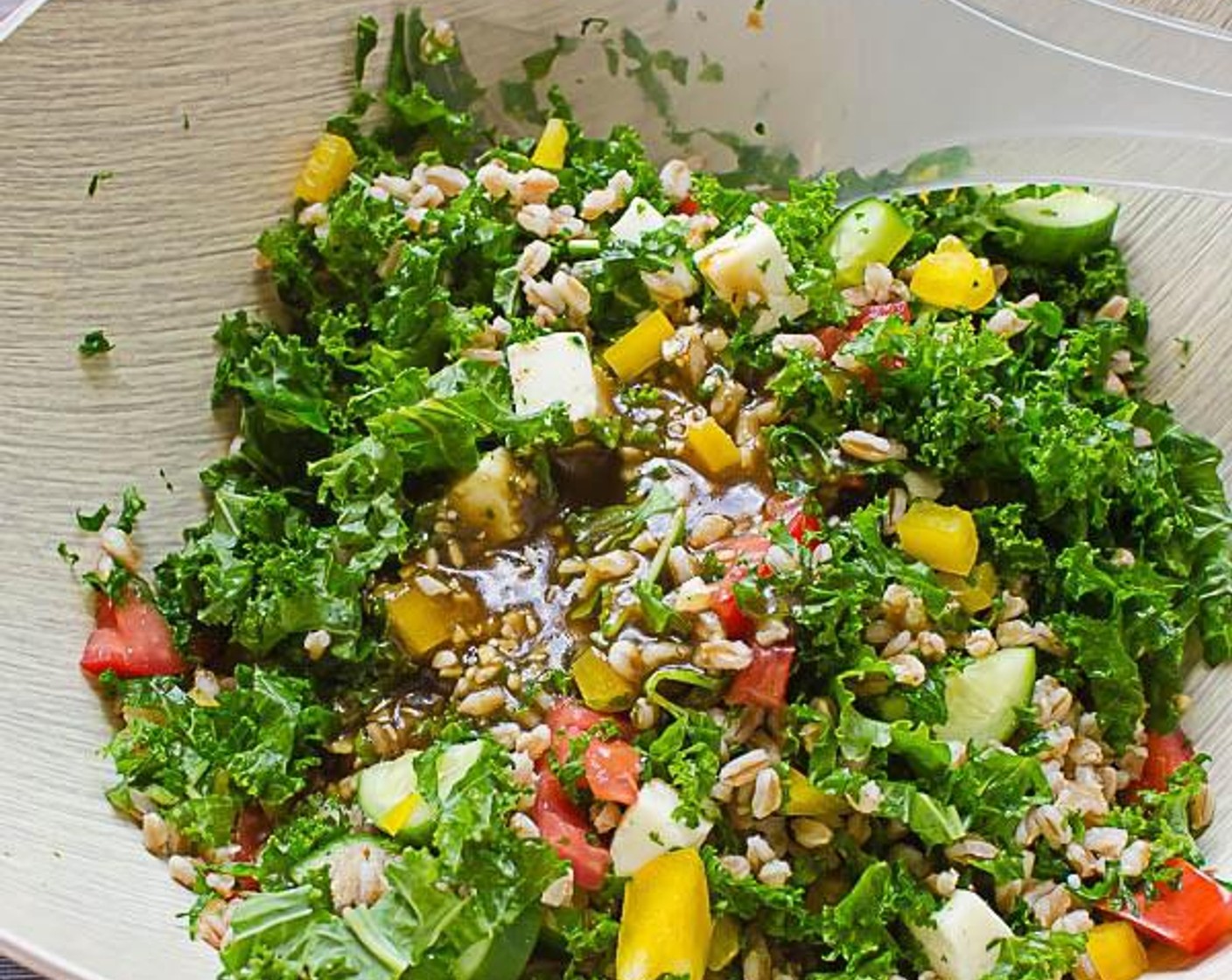 step 3 Transfer kale to a large bowl. Add the Bell Pepper (1), Plum Tomatoes (2), Cucumber (3/4 cup), Fresh Mozzarella Cheese Ball (1 cup) and Kalamata Olives (1/2 cup) and set aside.