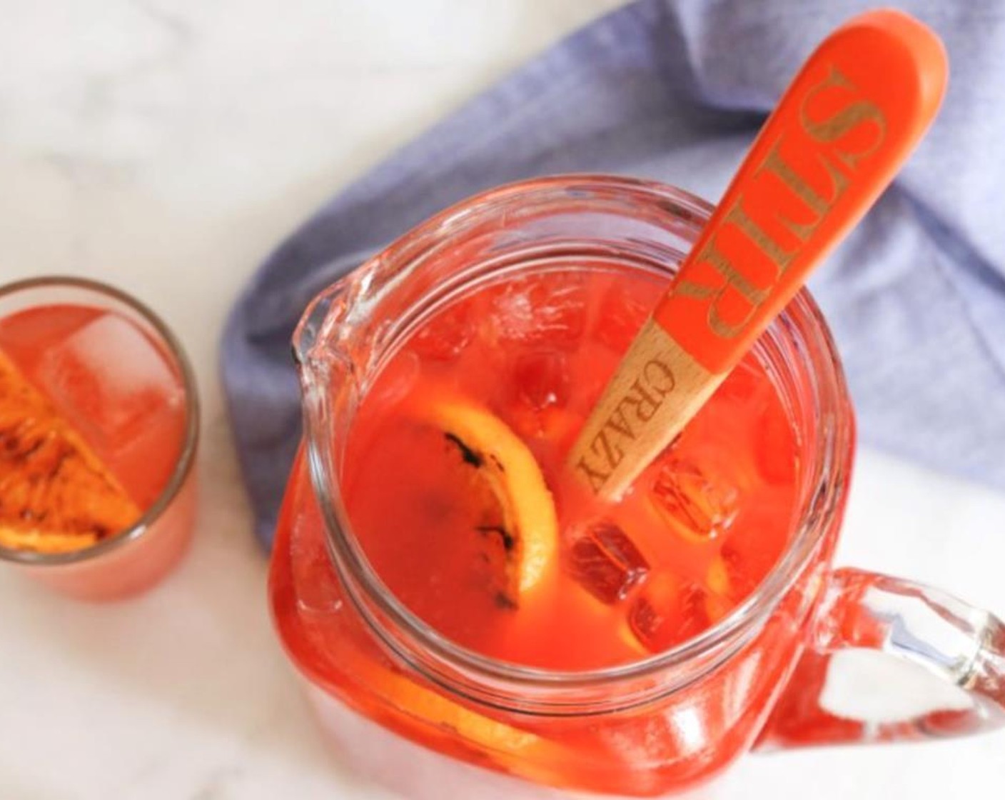 step 2 In a pitcher, combine the Campari (2 cups), Bourbon (2 cups), and Oranges (10). Add half of the cooled orange rounds. At this point, you can pop the punch into the fridge until ready to serve.