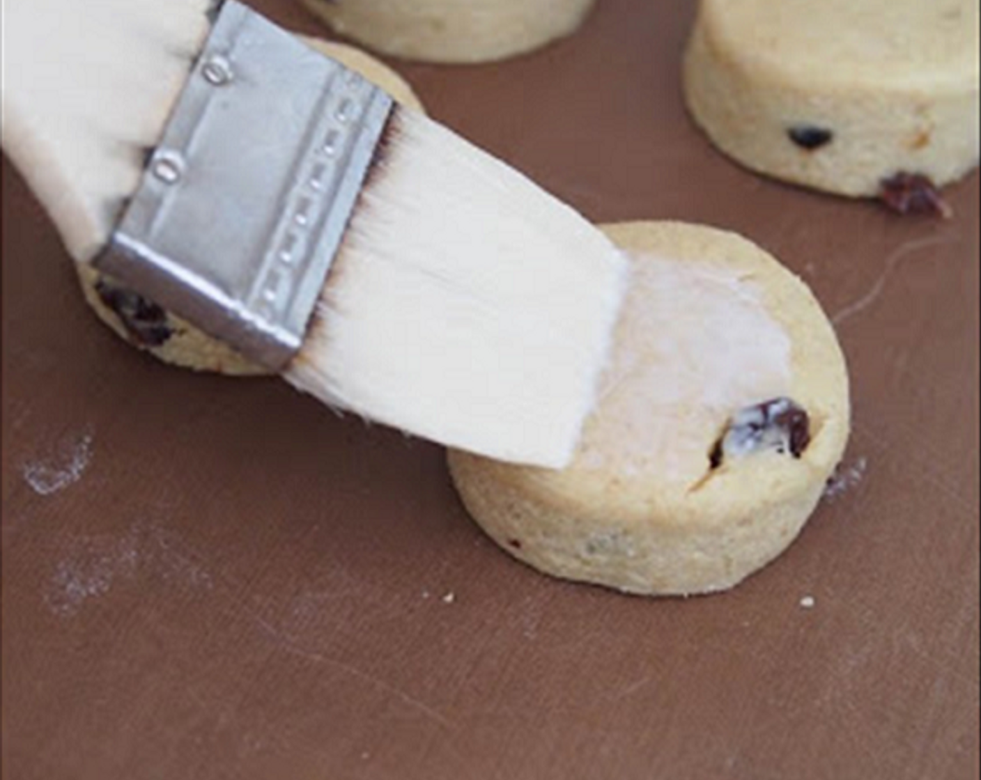 step 9 Place the scones on the lined baking tray, brush them lightly with buttermilk.