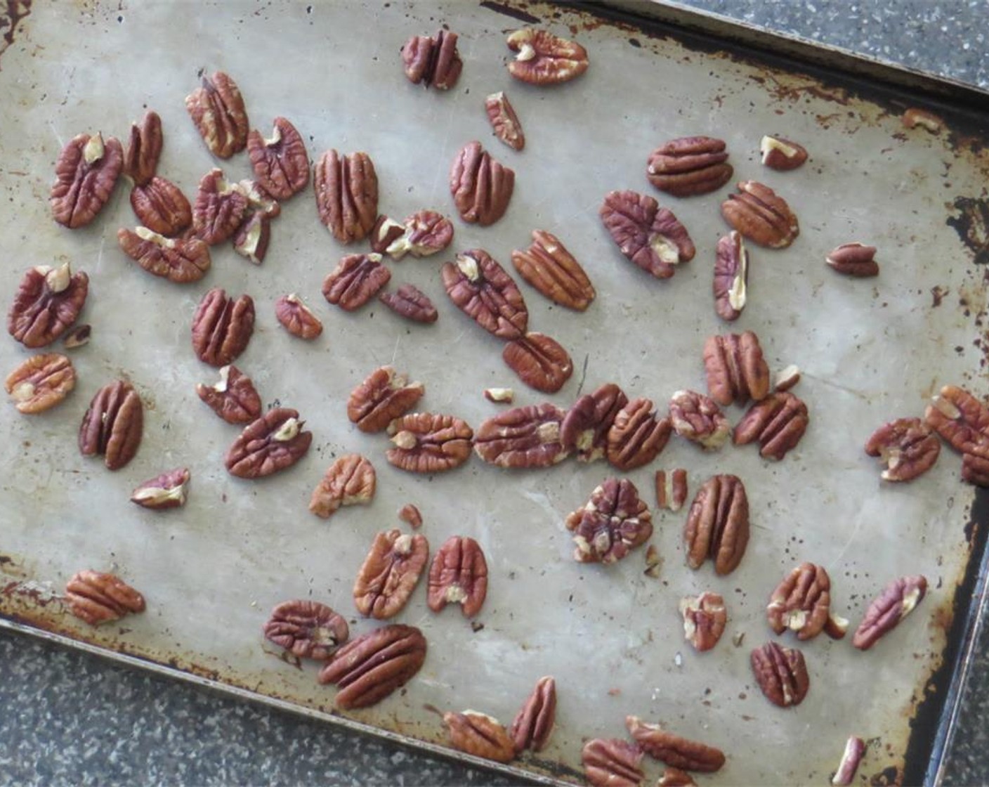 step 2 Place Pecans (1/3 cup) on a baking sheet and toast for 10-12 minutes until browned and fragrant. Transfer pecans to a cutting board and chop.