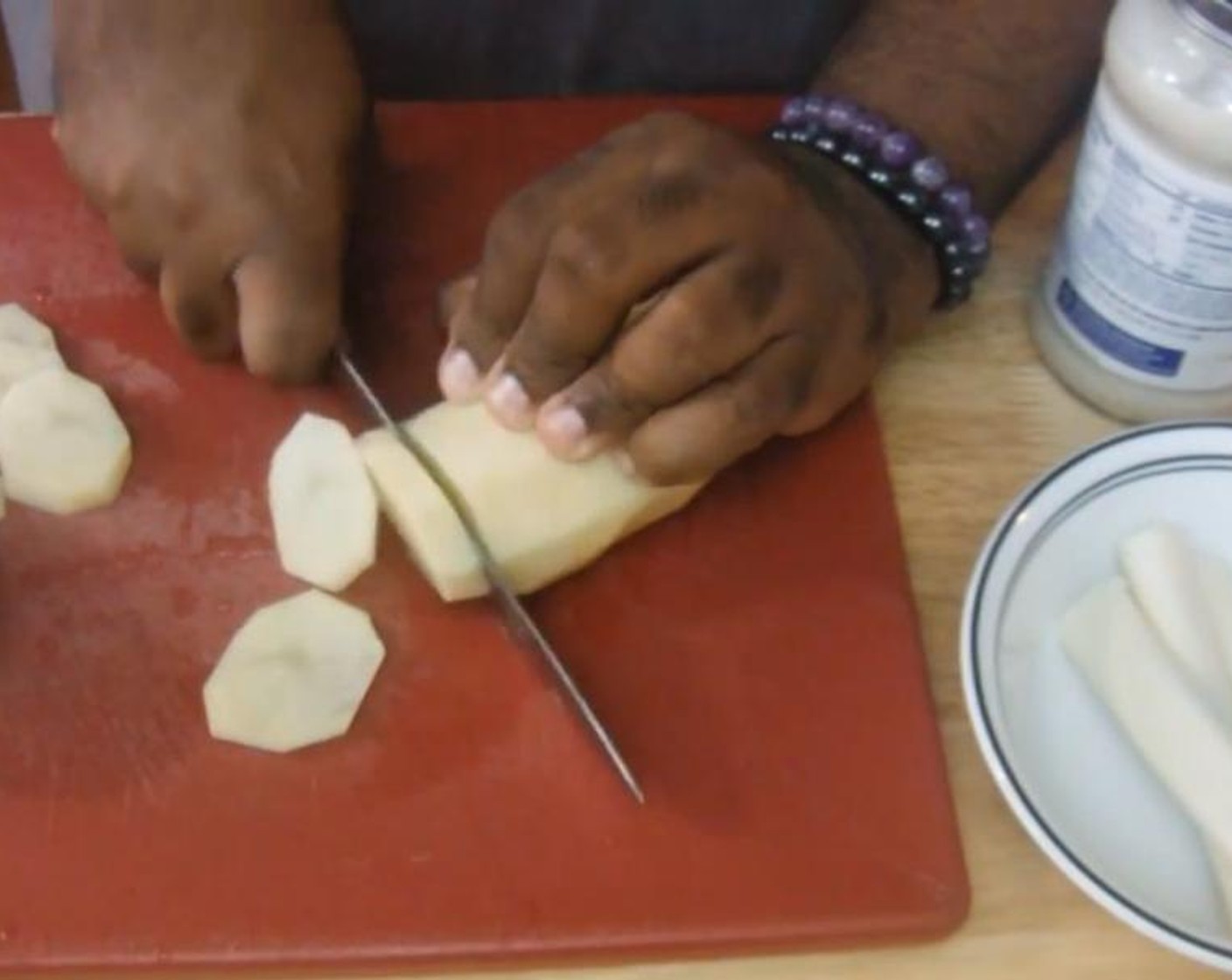 step 1 Soak Potatoes (1.5 lb) in ice water for about an hour. Drain them and slice them up.