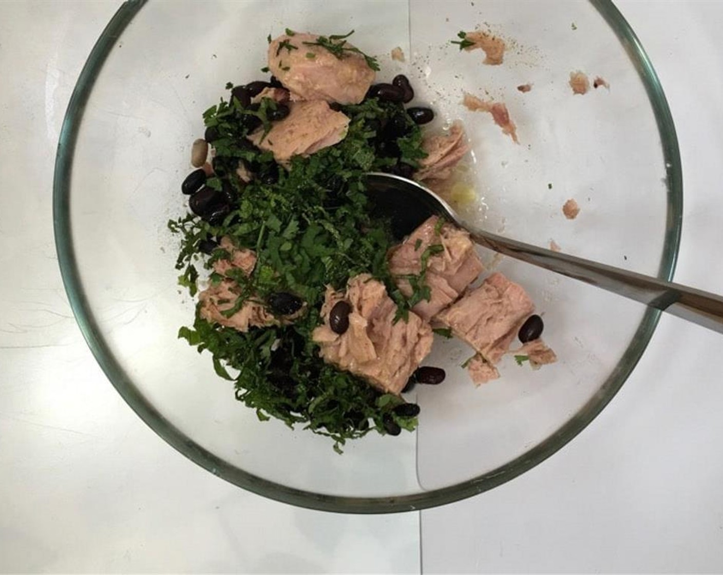 step 4 In another bowl, combine the Canned Tuna (1 can), Canned Black Beans (3 Tbsp), the rest of the Fresh Mint (1/2 handful), Salt (to taste), and Ground Black Pepper (to taste) to taste. Stir the tuna well. Place it in the fridge as well to chill.