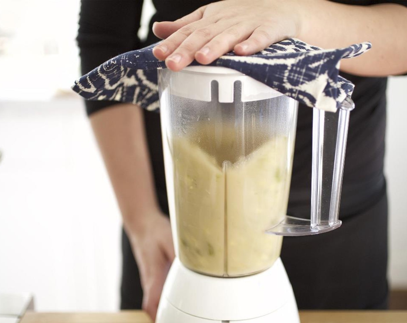 step 12 Pour soup in small batches into blender. Pulse until slightly pureed. Pour each batch back into the medium bowl you used for the vegetable broth; repeat until all of the soup is blended. Return the soup to the saucepot and heat over medium heat.