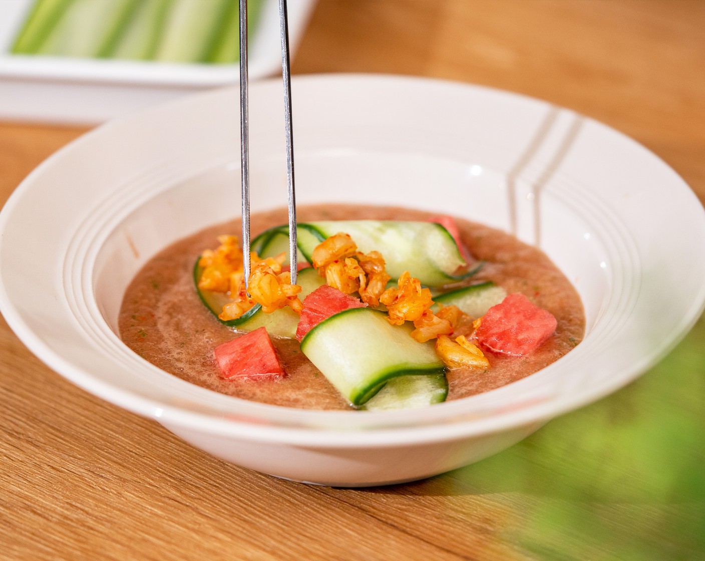 step 3 Transfer to a bowl. Top with reserved kimchi,  2 Tbsp of watermelon cubes, and Cucumbers (to taste). Optionally, garnish with Toasted White Sesame Seeds (1 tsp). Drizzle some olive oil and serve with Sourdough Bread (to taste).