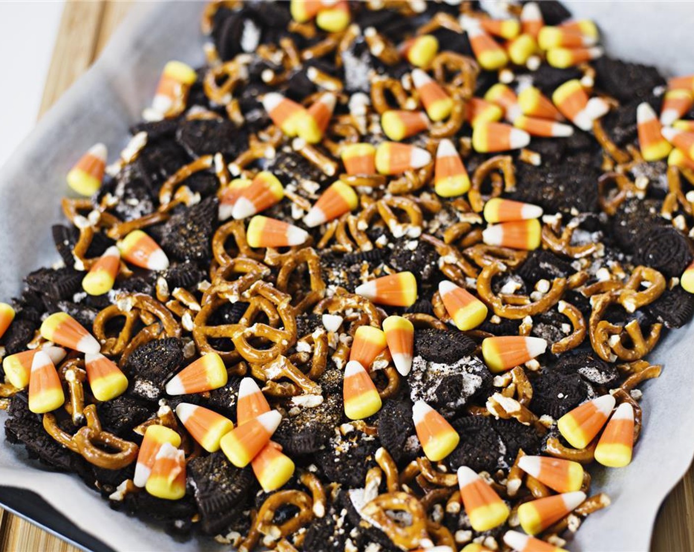 step 5 Evenly spread the Candy Corn (1 cup) on top of the Oreos and pretzels.