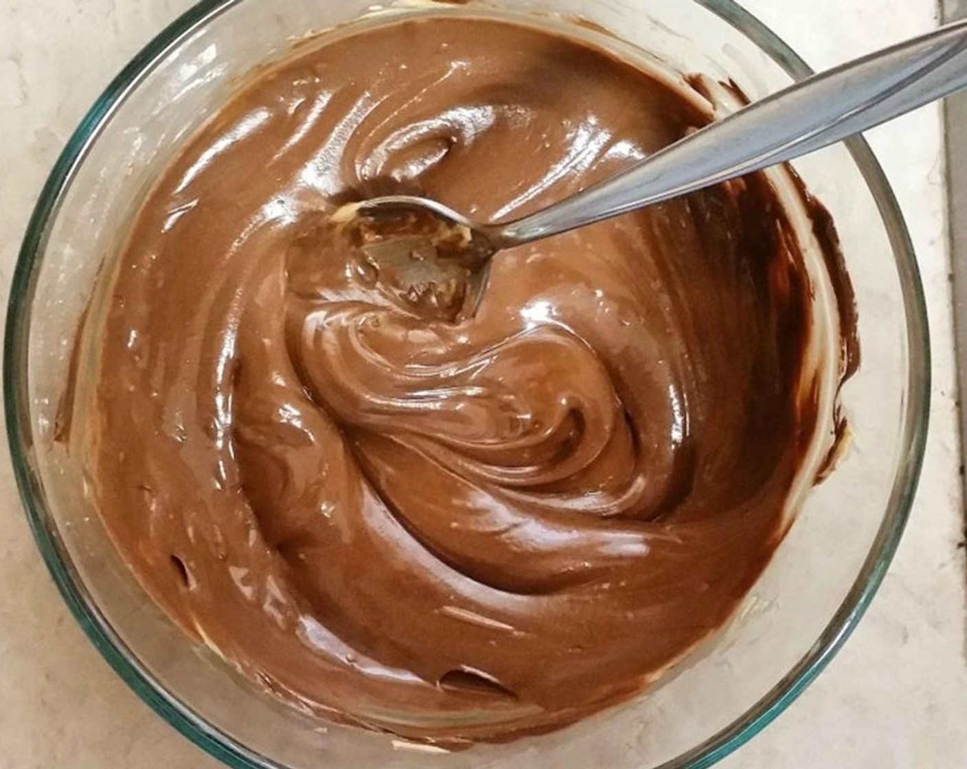 step 4 In the microwave, melt Chocolate Chips (1 1/2 cups) by microwaving for 30 seconds and stirring. When chips are melted, add Sweetened Condensed Milk (2/3 cup).