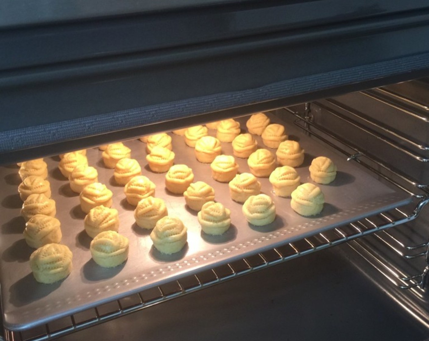 step 20 Bake in a preheated oven of 180 degrees C (350 degrees F) for 20 to 25 minutes or until the pineapple tarts turn golden brown in colour.