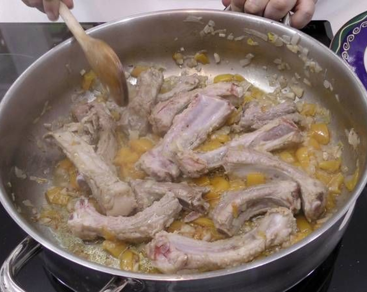 step 2 Once the bell pepper begins to soften up, add in the Pork Ribs (1.8 lb). Continue to cook slowly so the meat is tender once the dish is done.