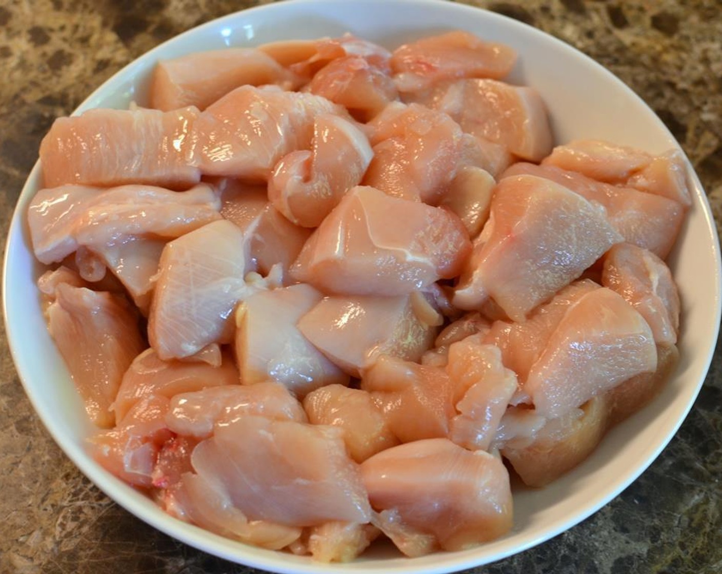 step 2 Cut Chicken Breasts (2) into approximately 1-inch pieces or bite-sized pieces.