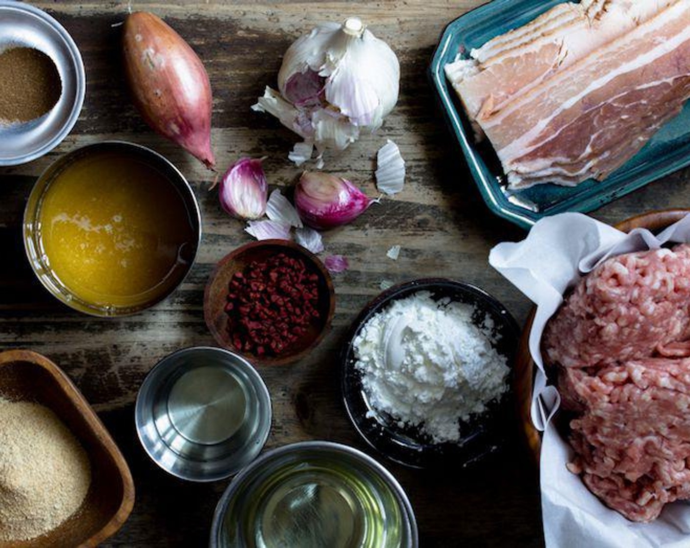 step 1 In a food processor, combine the Garlic (3 cloves), Shallot (1), Bacon (3 slices) and blitz until a paste forms. If you don’t have a food processor, you can chop this by hand, but it must be chopped very finely into almost a paste. Set aside for later.