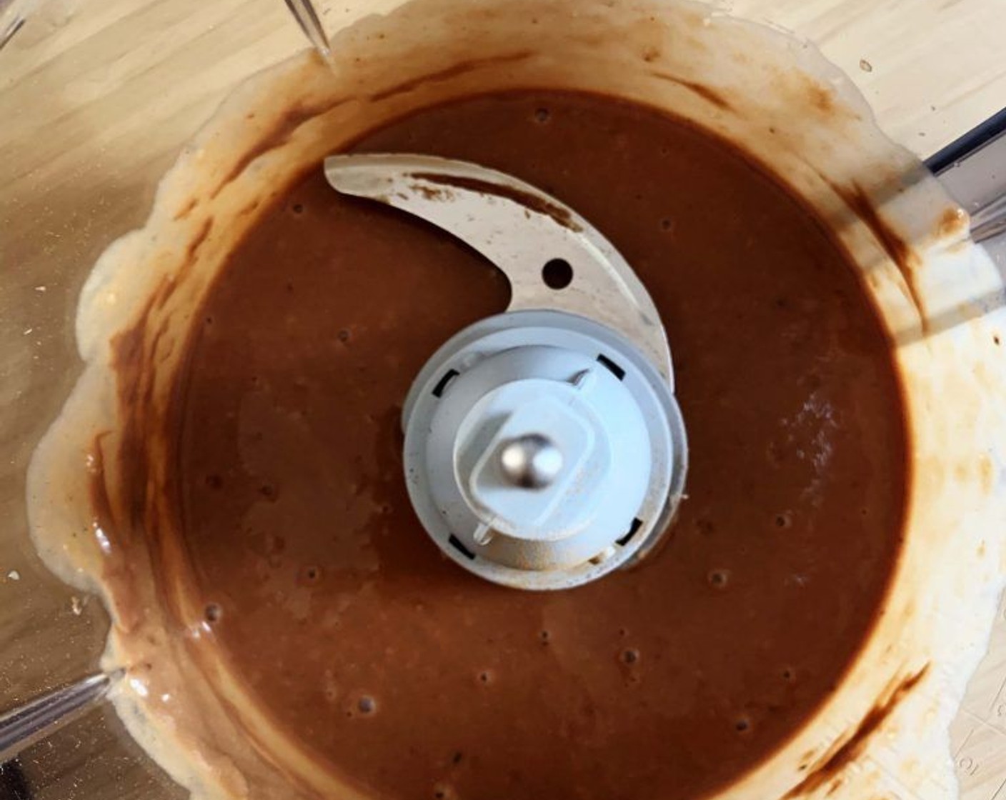 step 2 Place the Banana (1 cup), Chocolate Hazelnut Spread (3 Tbsp), Protein Powder (1 scoop), Ground Cinnamon (1 dash), Pink Himalayan Sea Salt (1 pinch) and Coconut Oil (1 tsp) into a food processor and blend until a smooth paste form