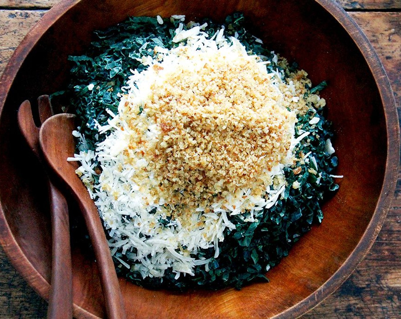 step 9 To assemble the salad: Place the Tuscan Kale (to taste) in a large bowl. Top with as much toasted bread crumbs you would like. Top with however much cheese you would like.