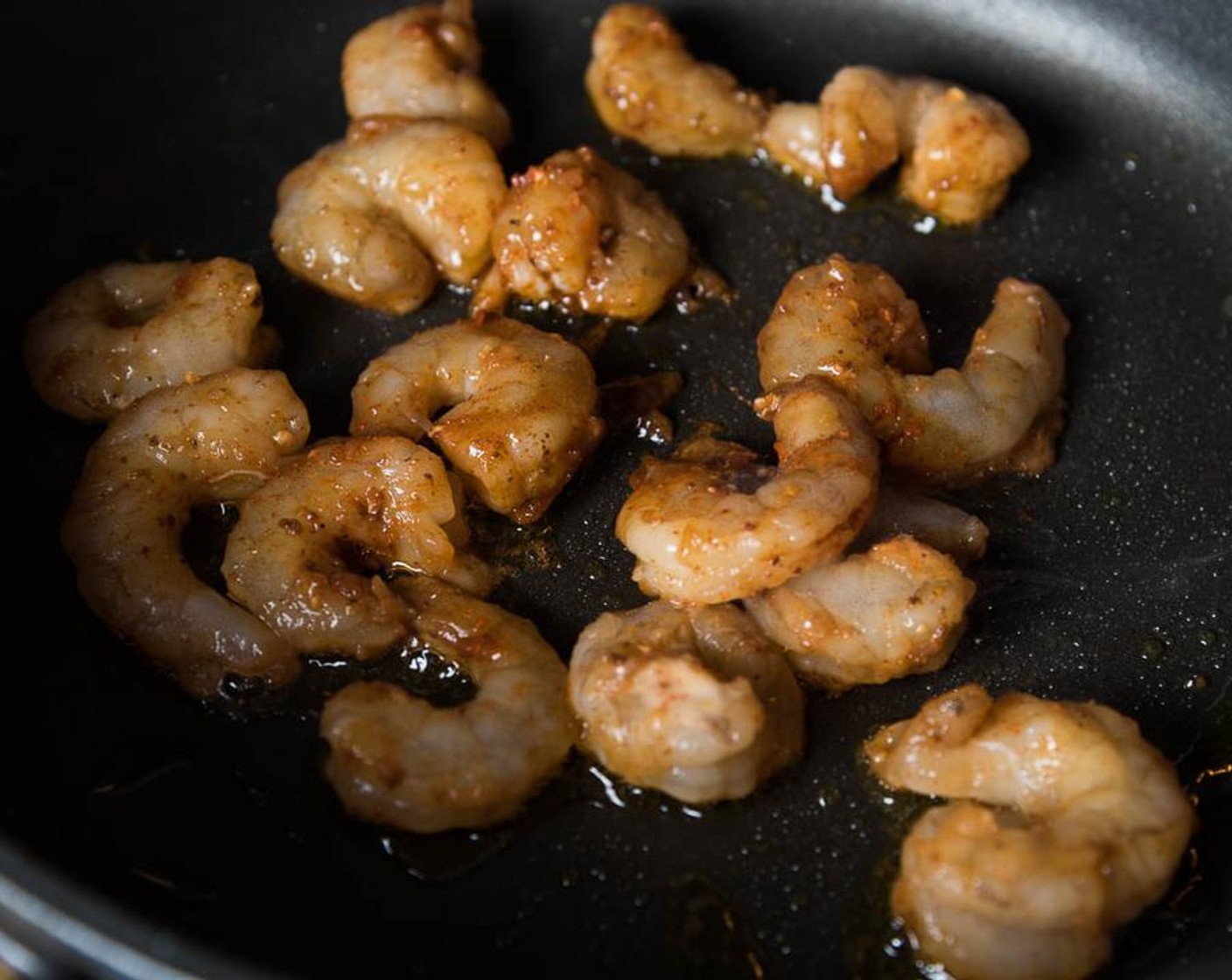 step 3 Heat Olive Oil (1 Tbsp) in a nonstick pan until hot. Add shrimp. Cook and occasionally stir, until the surface turns slightly golden and the shrimp have curled. Transfer to a plate immediately.