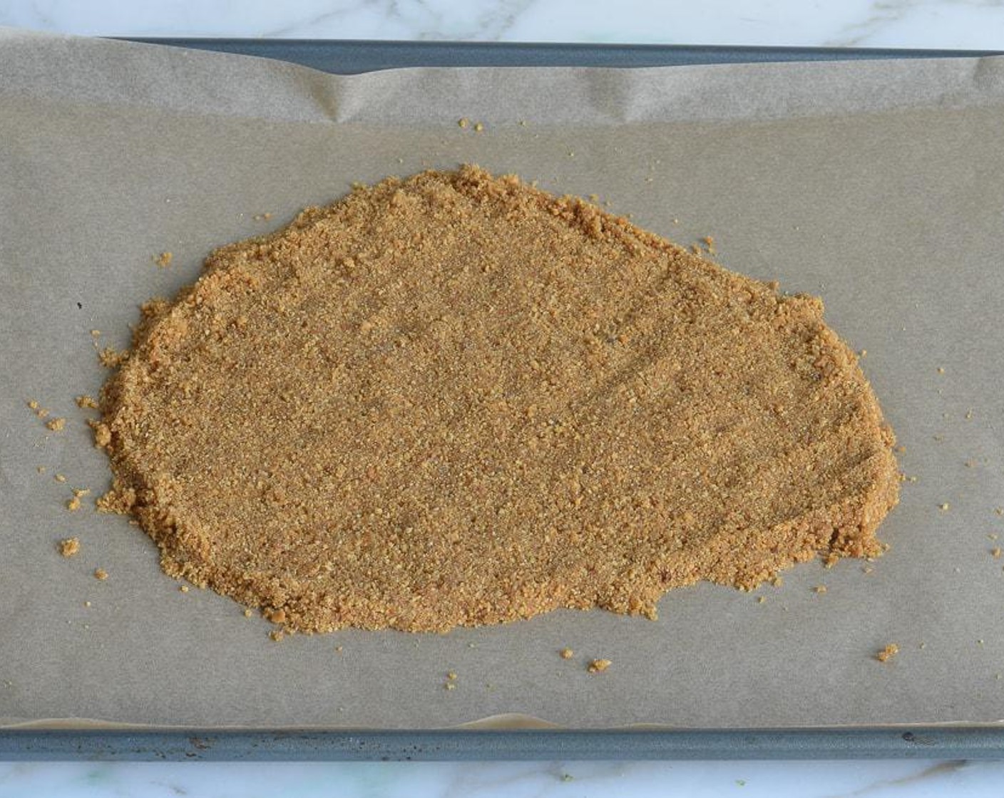 step 3 Press the crust into an even 1/4-inch layer on the prepared baking sheet. Bake until golden around the edges, 7 to 8 minutes.
