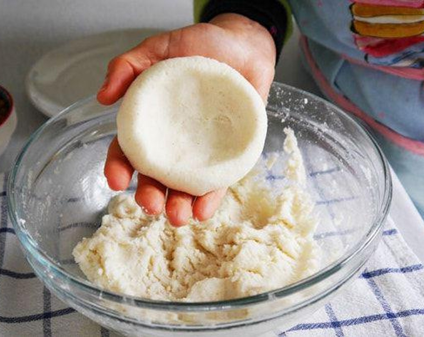 step 1 In a bowl add the P.A.N.® Harina Flour (2 cups), Salt (1 tsp), and Water (3 cups). Kneed until the dough is unified and smooth. Once the dough is soft make each ball at a time. With your finger start to create a whole in the middle of the ball to fit the filling.