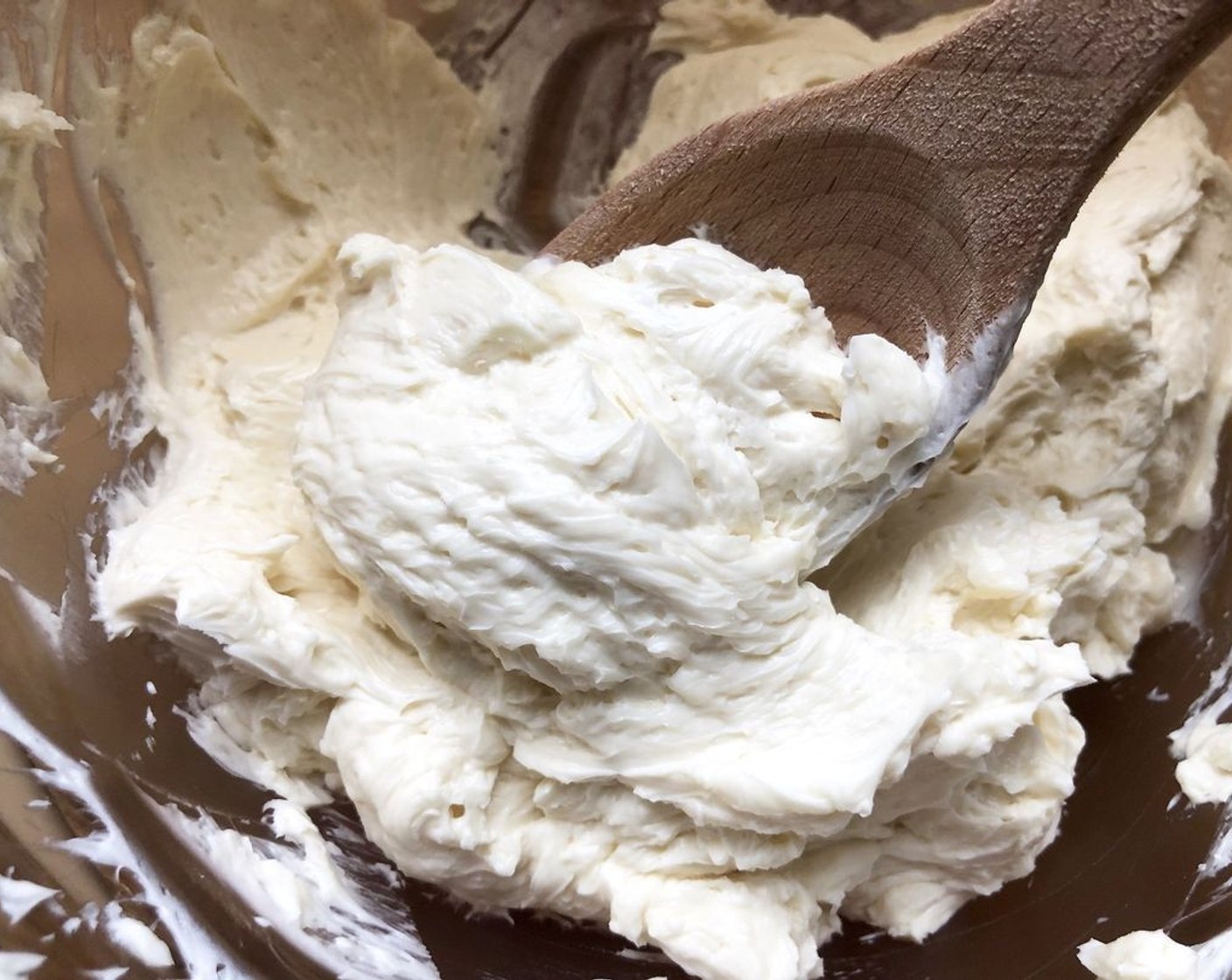 step 8 Using an electric mixer on medium-high speed, beat the Unsalted Butter (3/4 cup) in a large bowl, scraping down sides, until light and fluffy, 5–6 minutes. Add Pure Maple Syrup (1/4 cup) and Sea Salt Flakes (3/4 tsp) and beat, scraping down sides of bowl once more, just until incorporated.