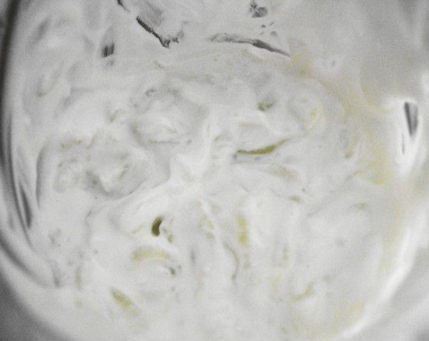 step 5 While the meatballs bake, make the easy yogurt sauce and gather the ingredients for assembly. To make the sauce, simply stir the Greek Yogurt (1 cup), Cucumber (1/2), Lemon (1/2), Olive Oil (1 dash), and Salt (1 pinch) together in a bowl. Set it aside until you need it.