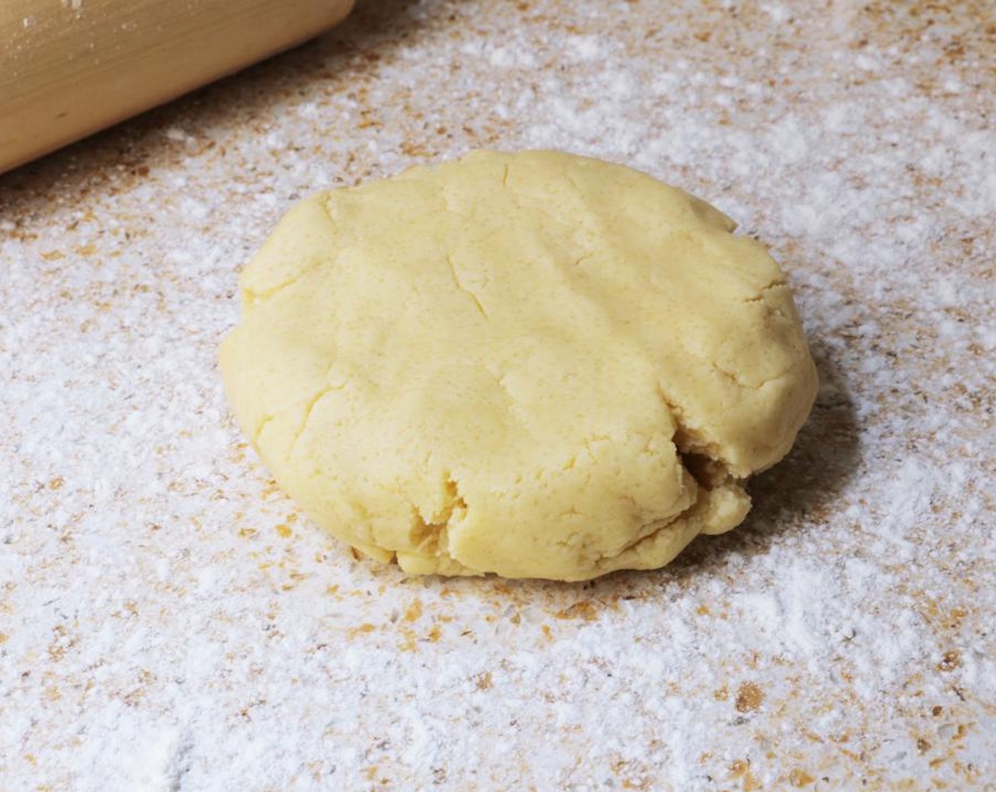 step 5 Turn the dough out on to a lightly-floured surface knead the dough by hand for about a minute.