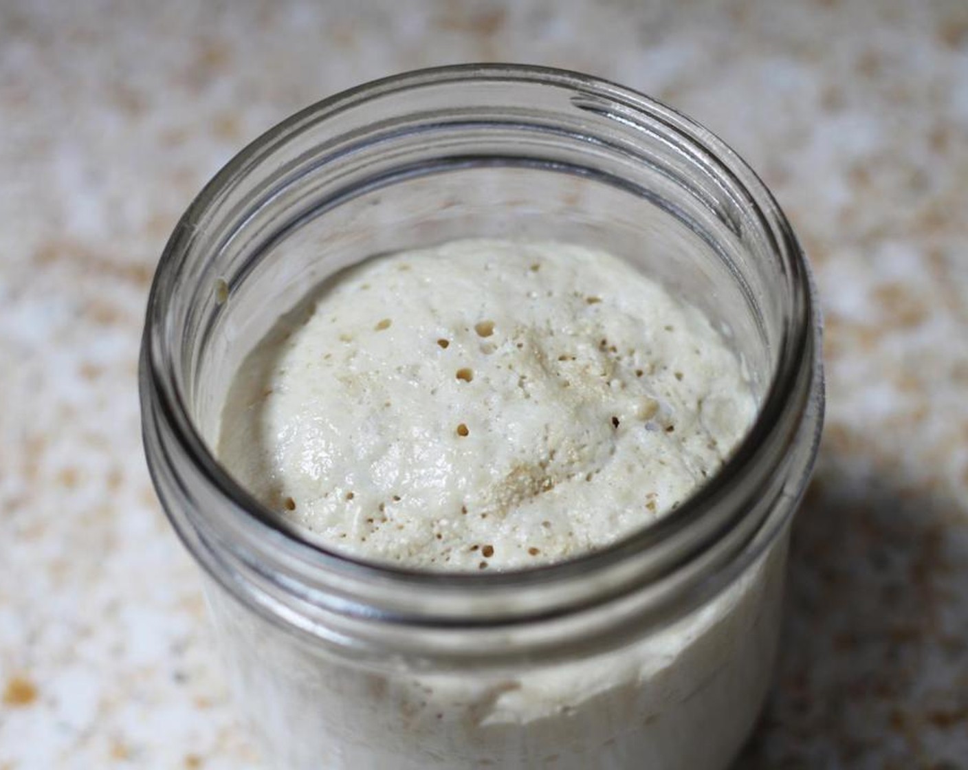 step 2 The surface of the milk and yeast mixture should be foamy, and smell slightly yeasty.