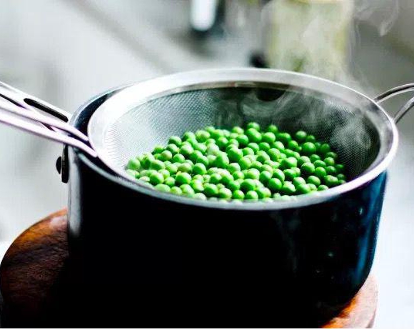 step 4 Blanch Green Peas (2 cups) in 1 quart boiling salted water with 1 tablespoon salt for 2 minutes. They should float. Strain and immediately immerse in cold water to stop them from over cooking and loosing their color. Set aside.