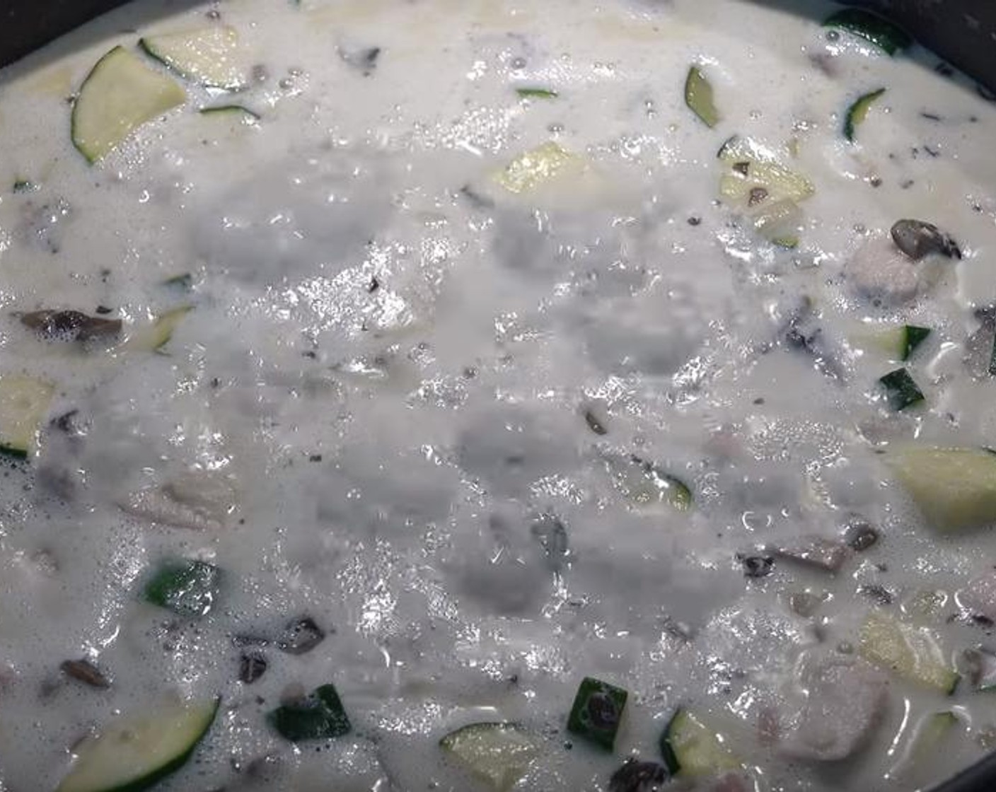 step 4 Add in Zucchini (2), Button Mushrooms (2 cups). Stir. Allow it to cook for another five minutes, stirring occasionally.