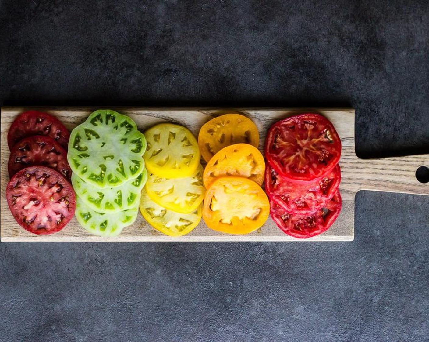 step 4 While the pastry bakes, slice your Heirloom Tomatoes (to taste) into 1/4 inch slices, you will need 3-4 slices of each color, depending on the size of your tomatoes.