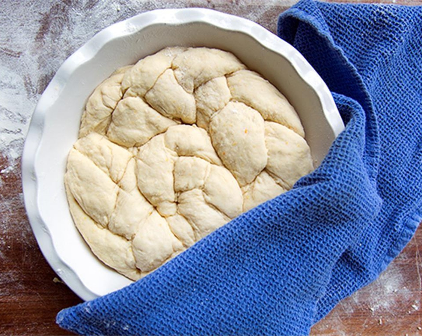 step 8 Coil the braided dough in a prepared spring form pan, or pan of your choice, that has been buttered. Cover loosely with a damp cloth and let rise again for about 30 minutes or until doubled in size.