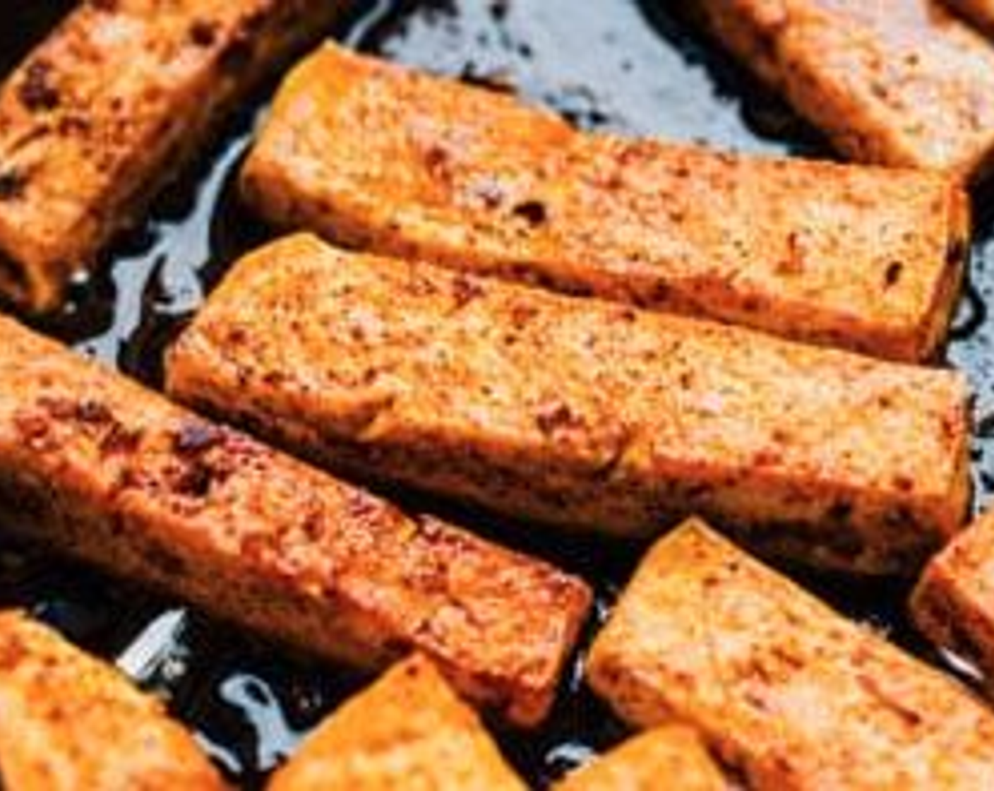 step 2 Pat Firm Tofu (1 pckg) dry with paper towels, then cut into long 1/2-inch thick strips. Add to a bowl with the Smoked Paprika (1/2 tsp), Salt (1/4 tsp), Chili Powder (1/4 tsp), Finely Ground Black Pepper (1/4 tsp) and gently rub to coat. Heat Oil (1 Tbsp) in a large oven-safe or cast-iron skillet over medium-high. Add tofu and cook on all sides until crispy, about 5 minutes.