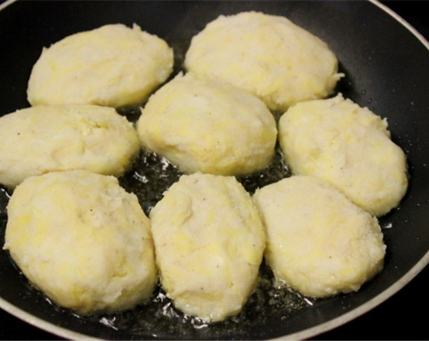 step 6 In a nonstick skillet, heat Oil (2 Tbsp) and add the potato cakes.