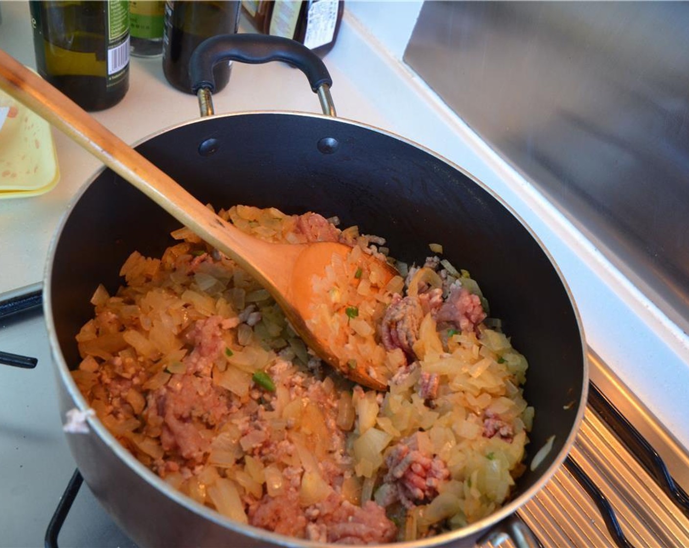 step 6 Increase the heat and brown Ground Beef (1 lb). Stir every once in awhile to ensure the meat doesn't burn.