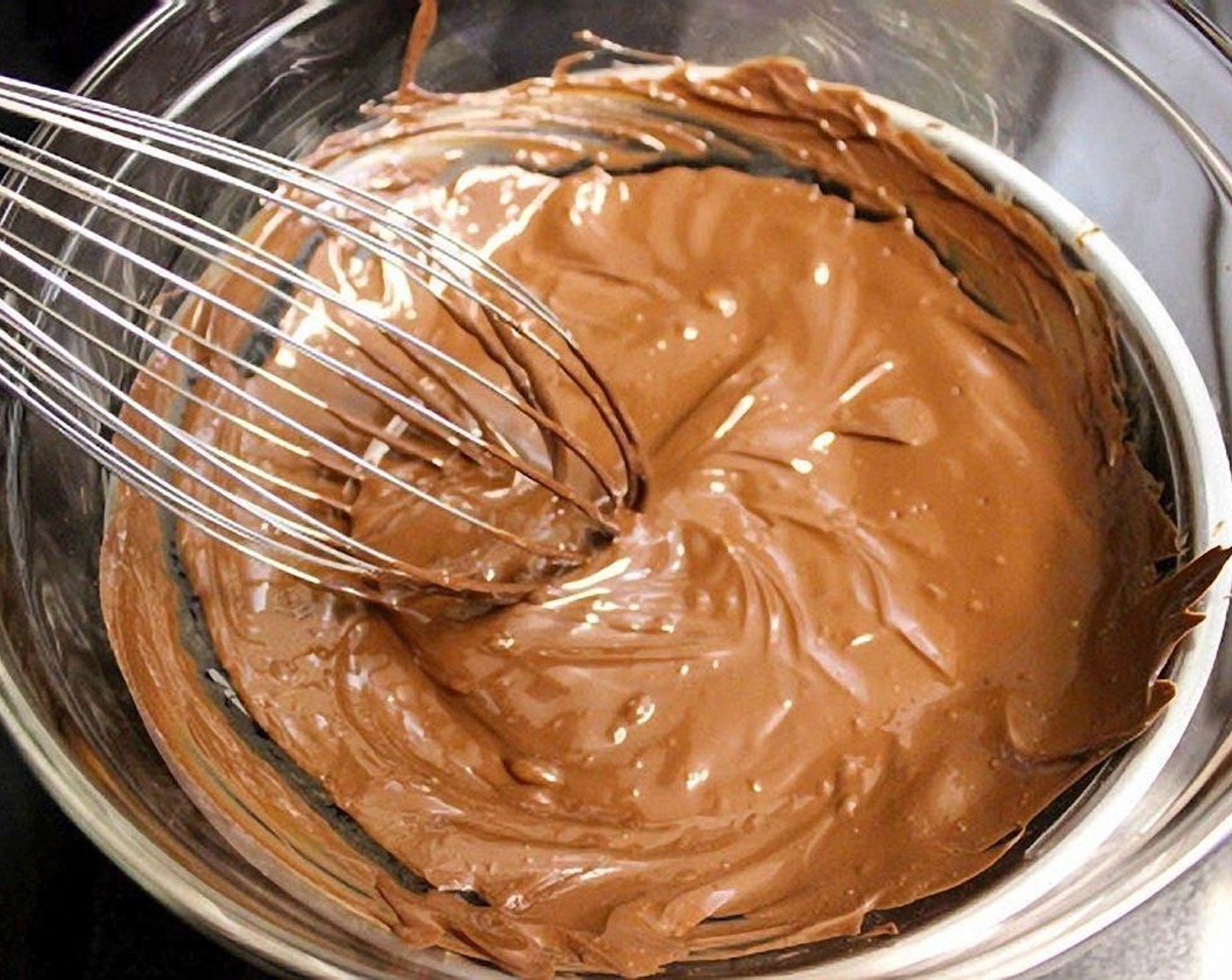 step 4 Whisk until the chocolate melts. Set aside to cool.