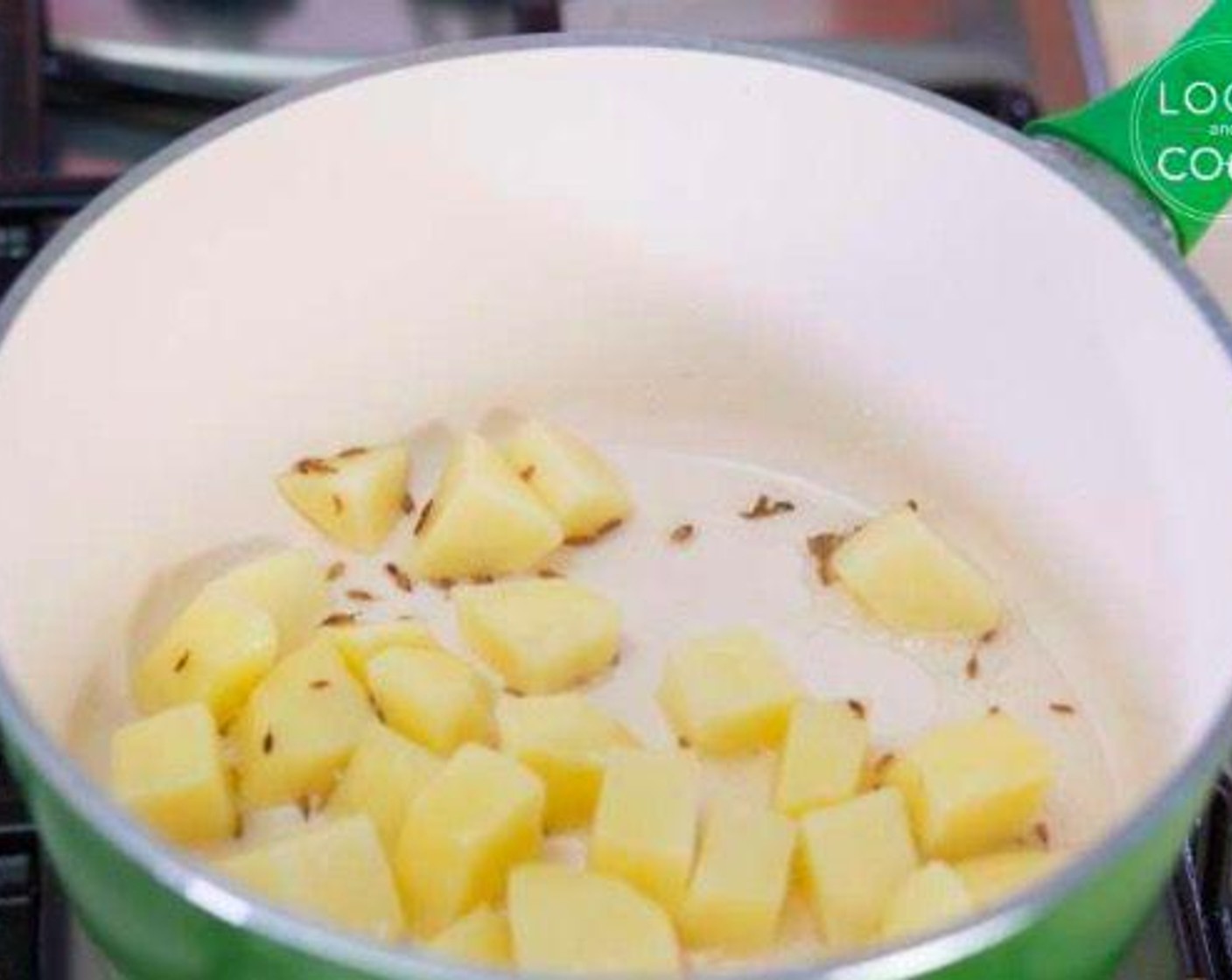 step 4 When they turn golden brown, add potatoes and cook partially.