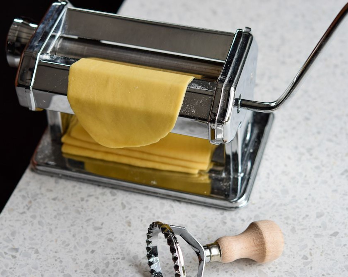 step 7 Halve the dough and keep one half wrapped in clingfilm to prevent it from drying out. Using a pasta machine or a rolling pin, roll out half the dough until you have a thin strip about 8cm wide.