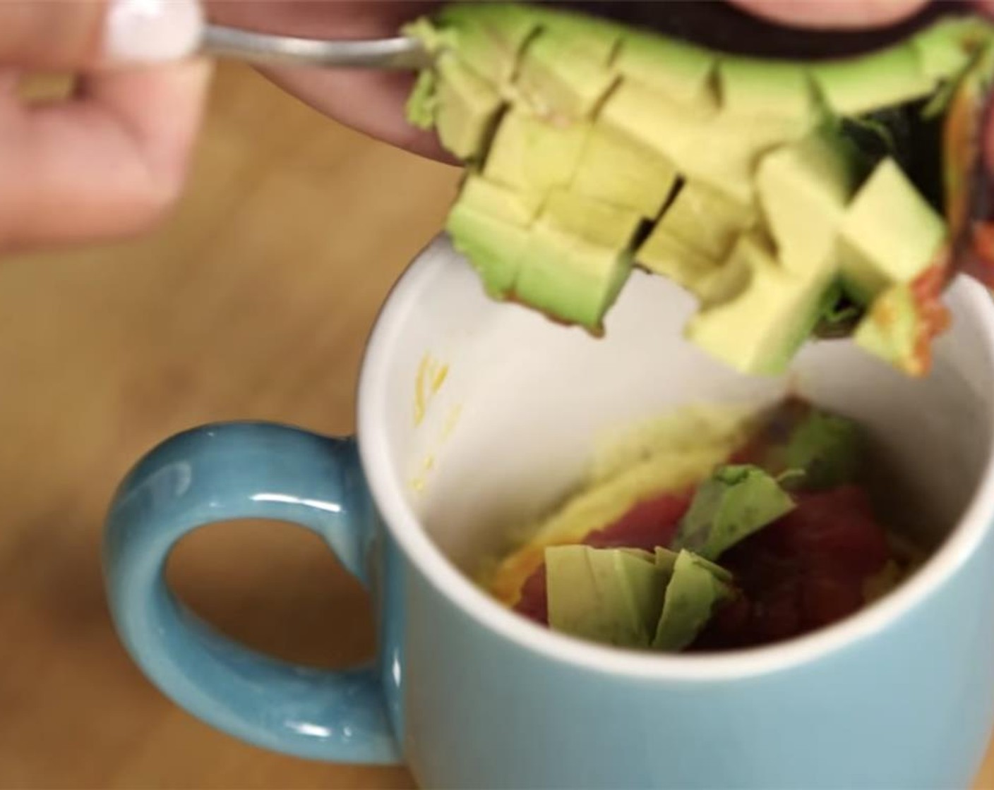 step 5 Spoon avocado into the mug.