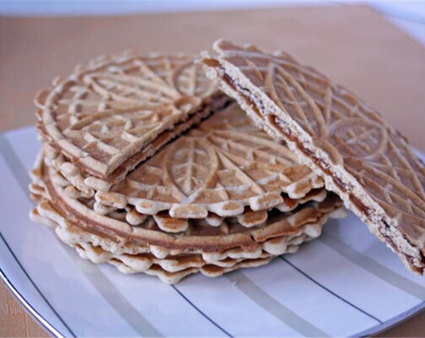 step 10 Once all of the cookies are done and cooled spread a thin layer of caramel on one and top with another.