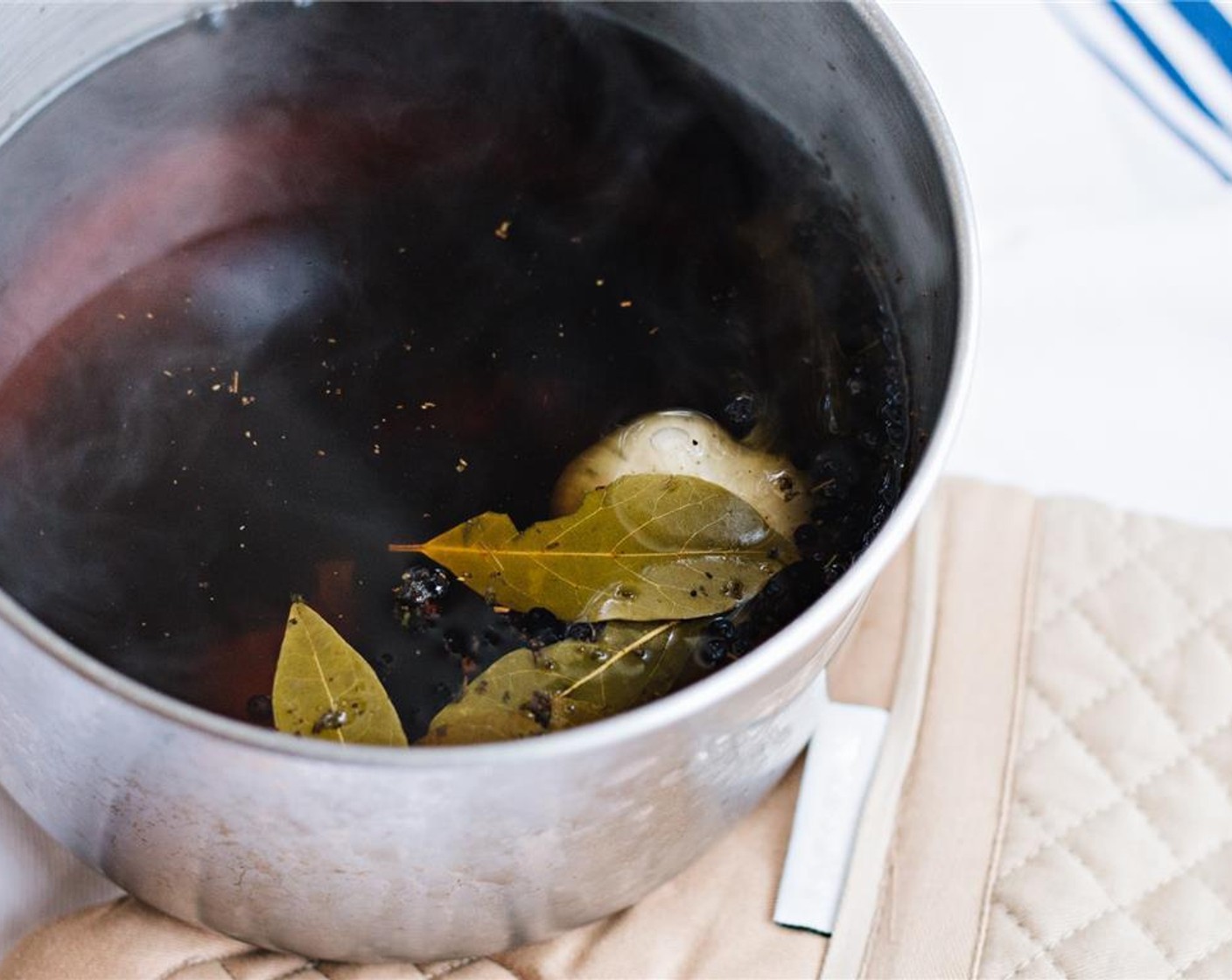 step 1 For the maple brine, in a medium pot, combine the Water (6 cups), Kosher Salt (1/4 cup), Grade B Maple Syrup (1/4 cup), Granulated Sugar (2 Tbsp), Dried Thyme (2 Tbsp), Black Peppercorns (1 Tbsp), Bay Leaves (2), and Garlic (1 head). Bring to a boil.