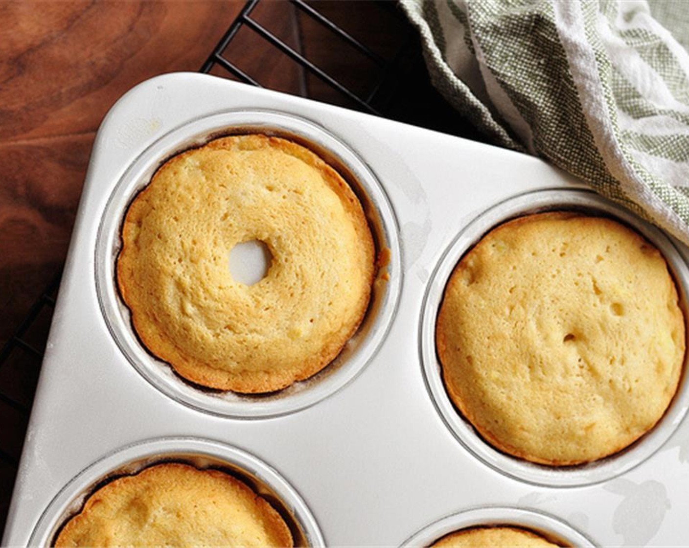 step 11 Bake for about 20-25 minutes or until golden brown. Rotate the pan halfway through baking to ensure even browning and cooking. You’ll know the cakes are done when a toothpick, inserted in the middle, comes out clean.