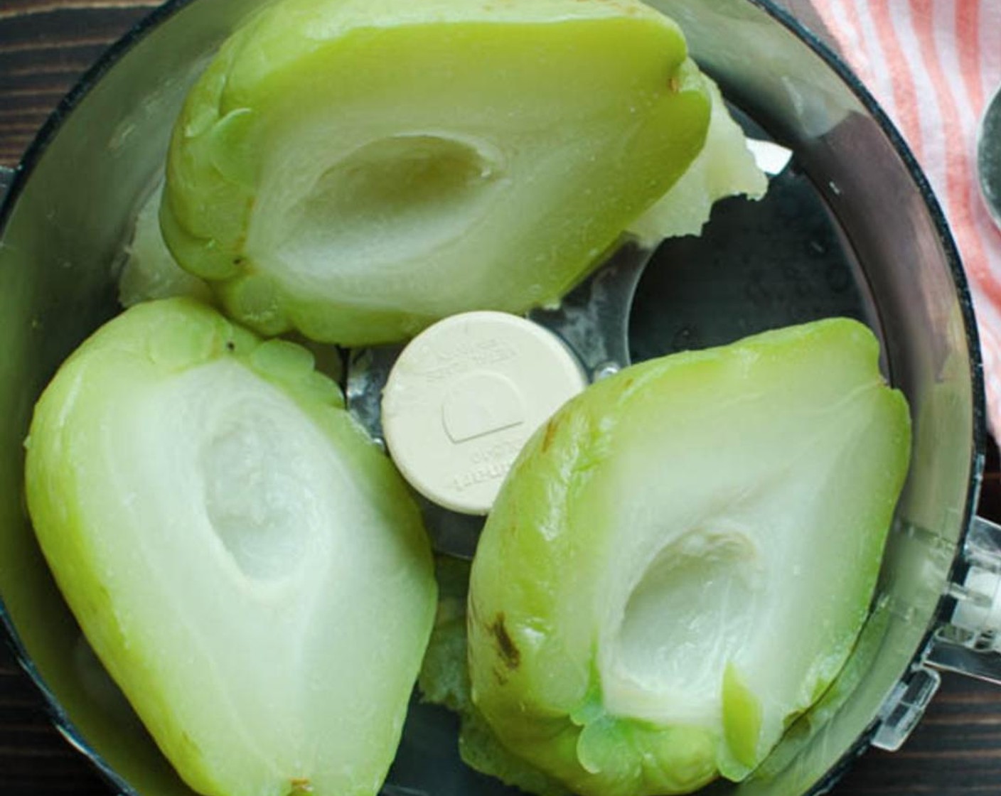 step 4 Slice the Chayote Squash (2)  in half lengthwise and remove the seed. Add the chayote to the boiling water reduce heat to a simmer and cook for 30-35 minutes or until tender.