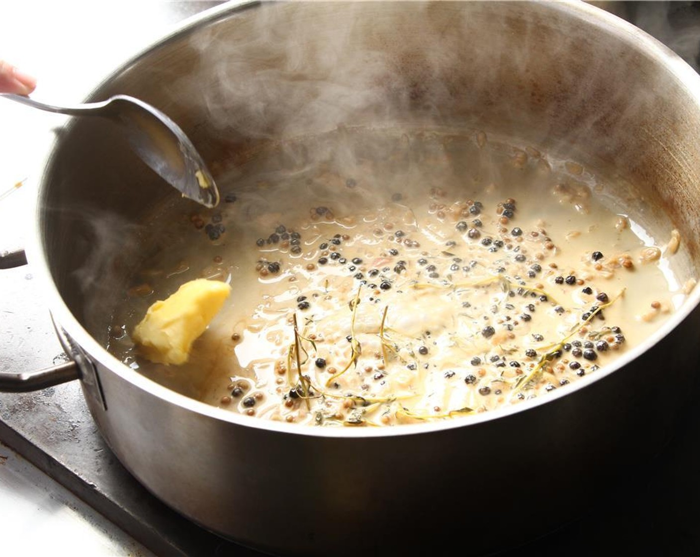 step 11 Add Butter (1 oz) over low heat, swirling pan the entire time.  Add about 3 pieces at a time, waiting until butter is fully incorporated before adding the next batch.
