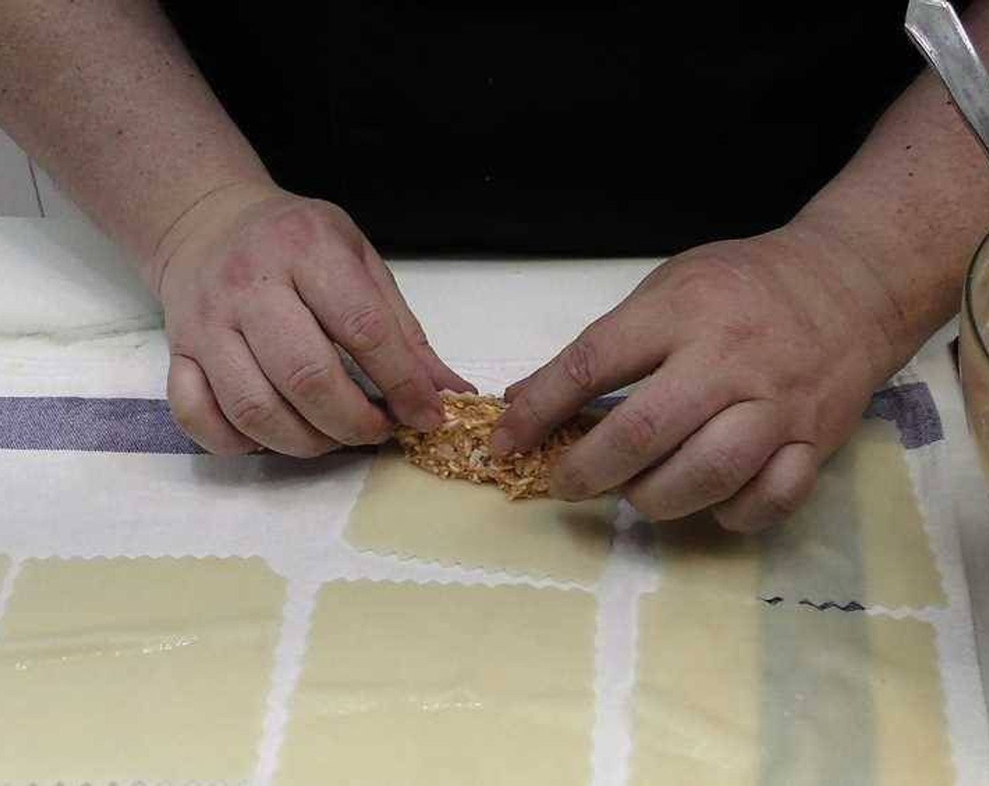 step 4 Add some of the filling to each sheet of pasta and roll them up. As you roll them, place them on an oven-safe plate or dish with the seams face down to avoid them unwrapping.